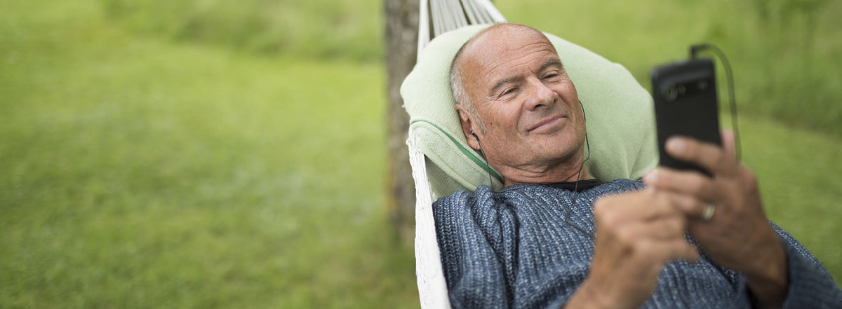 Man listening to Spotify on a Doro smartphone
