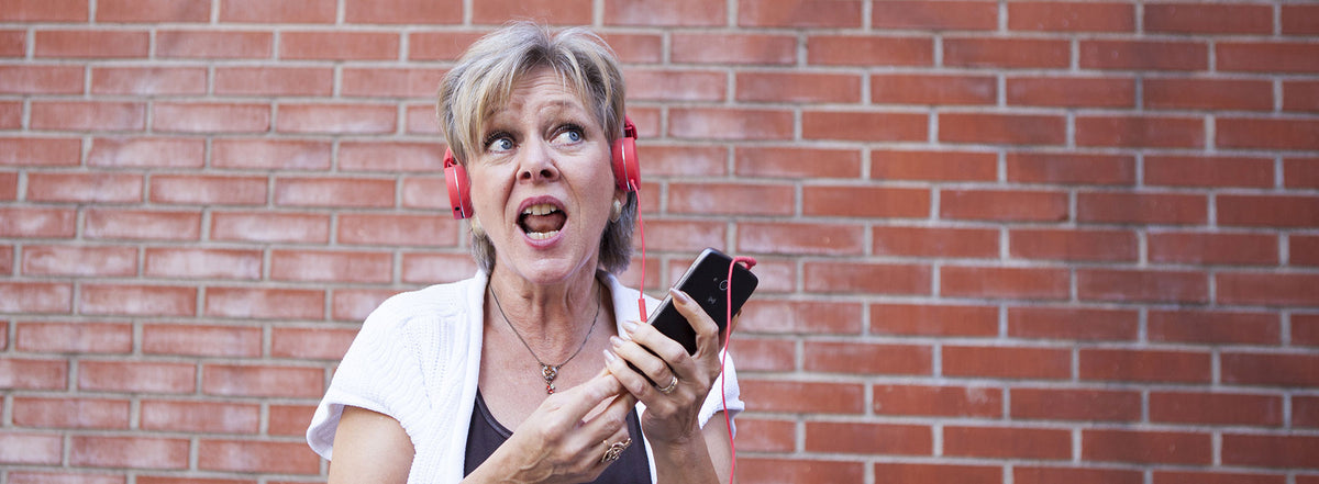 Woman using a smartphone with headphones