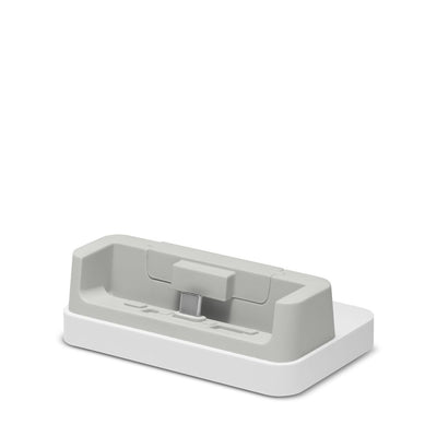 White and gray electronic device stand on a white background